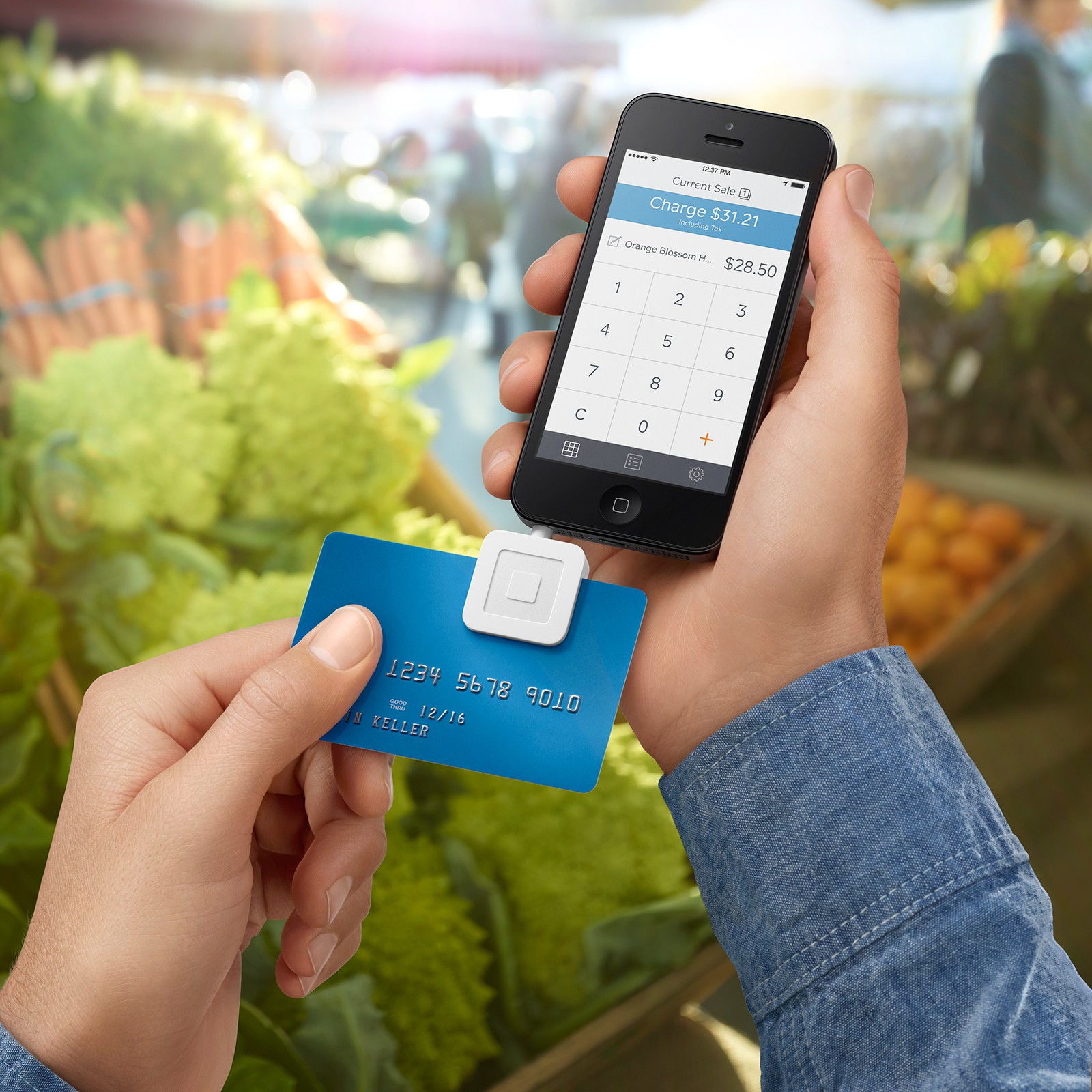 Square register swiping credit card at food market